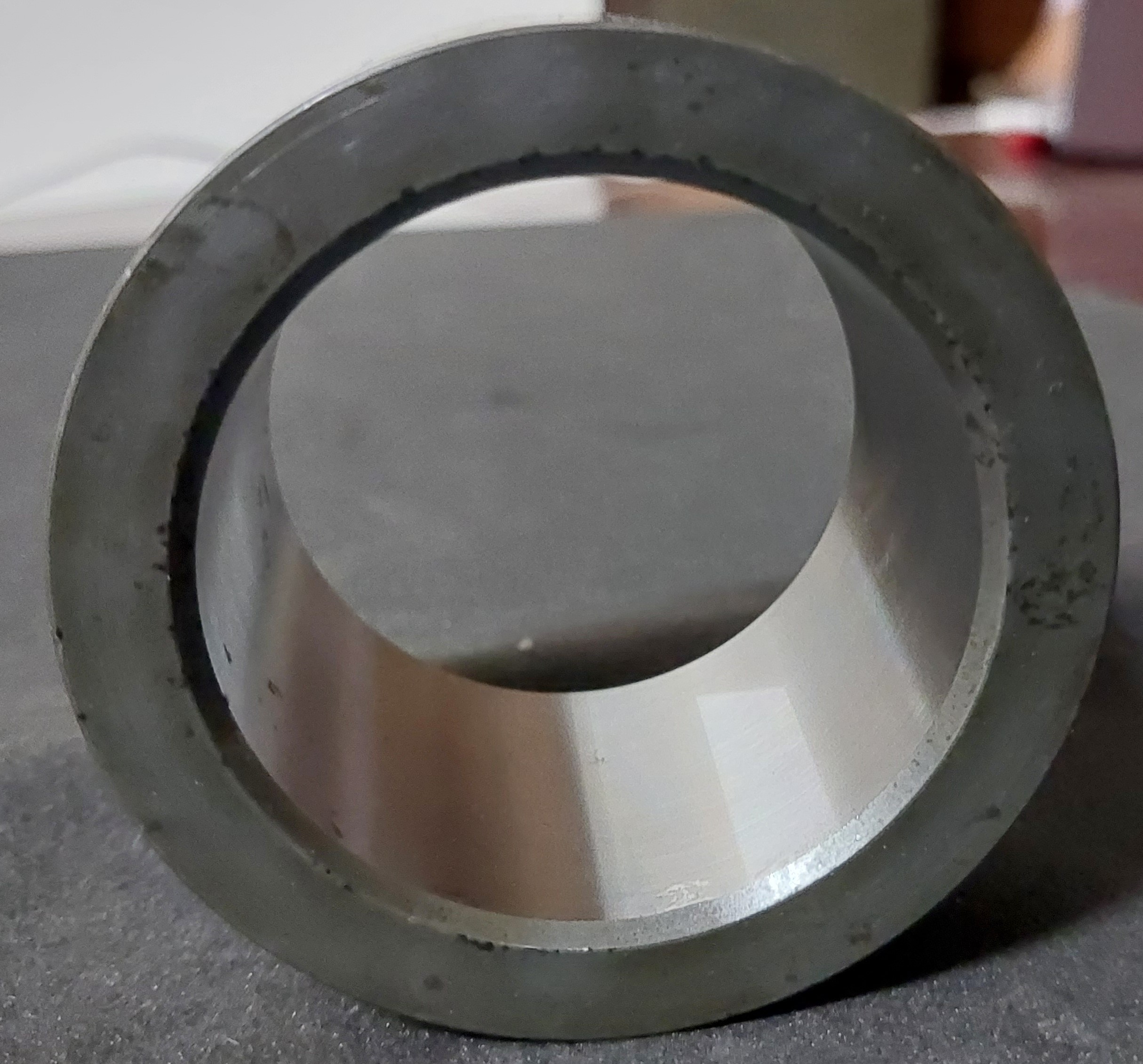 Installation of 83910634 bush in a backhoe bucket pin assembly.